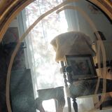 Antique oval gilded stucco mirror