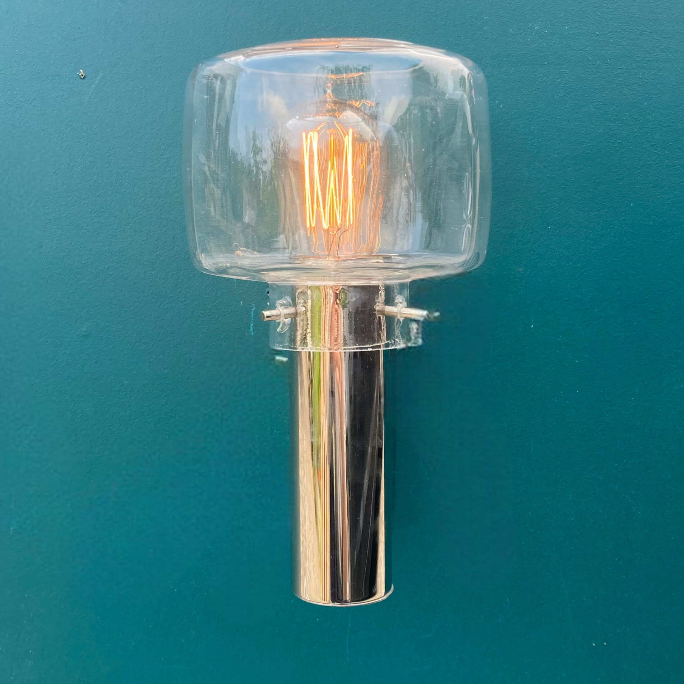 Wall lamp in stainless steel and globe in transparent glass