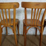 4 mismatched signed bistro chairs