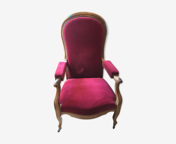 Fauteuil voltaire à roulettes en velours rouge