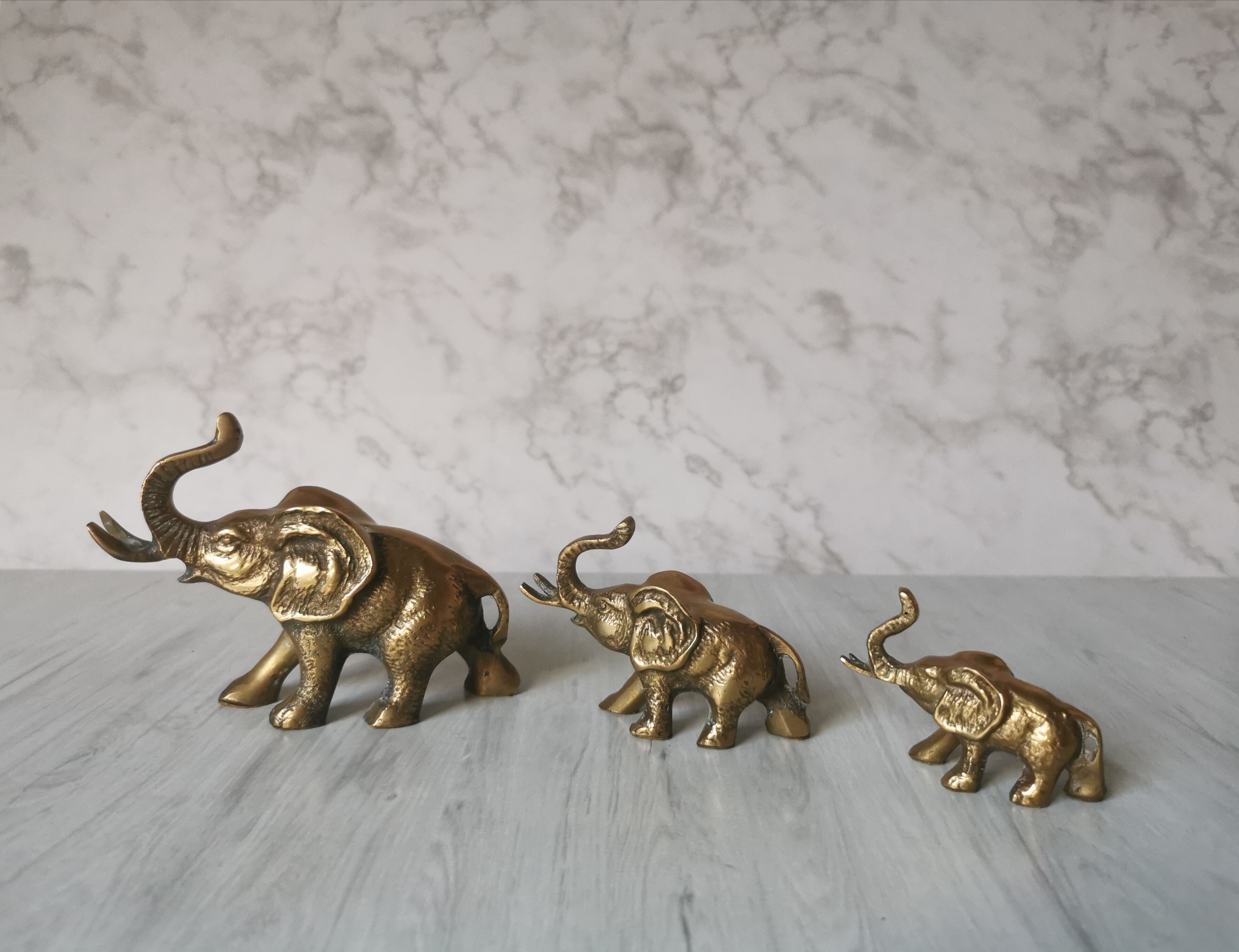 Trio of brass elephants