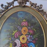 Painted under glass convex medallion in bronze