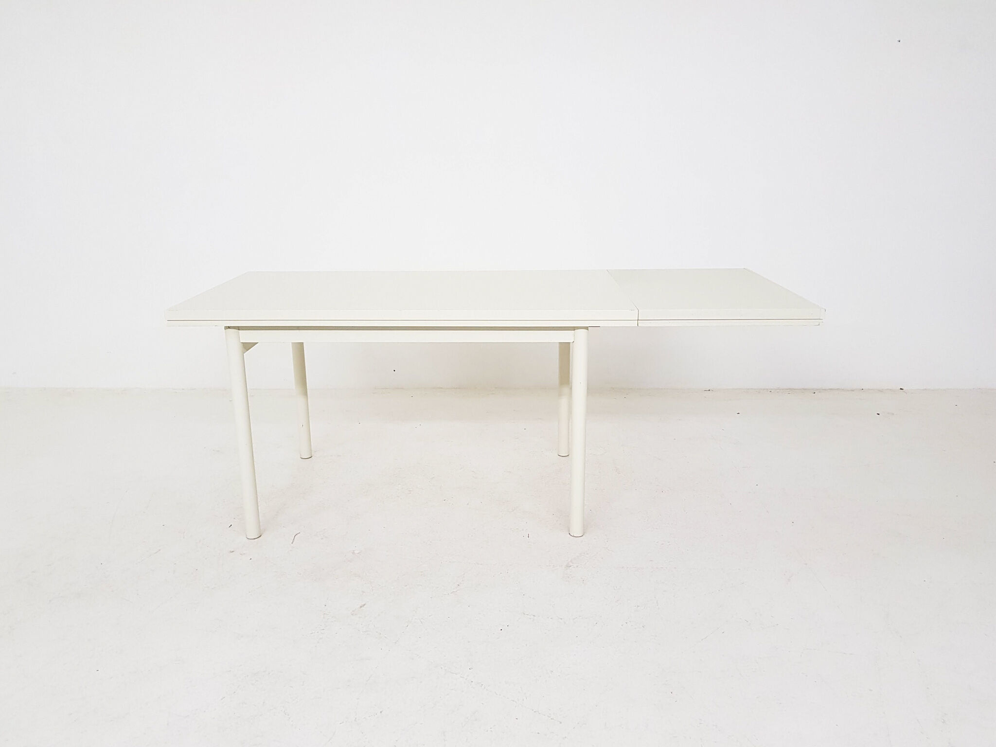 Beige extendable wooden table