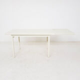 Beige extendable wooden table