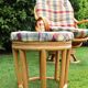 Swivel rattan armchair with matching ottoman