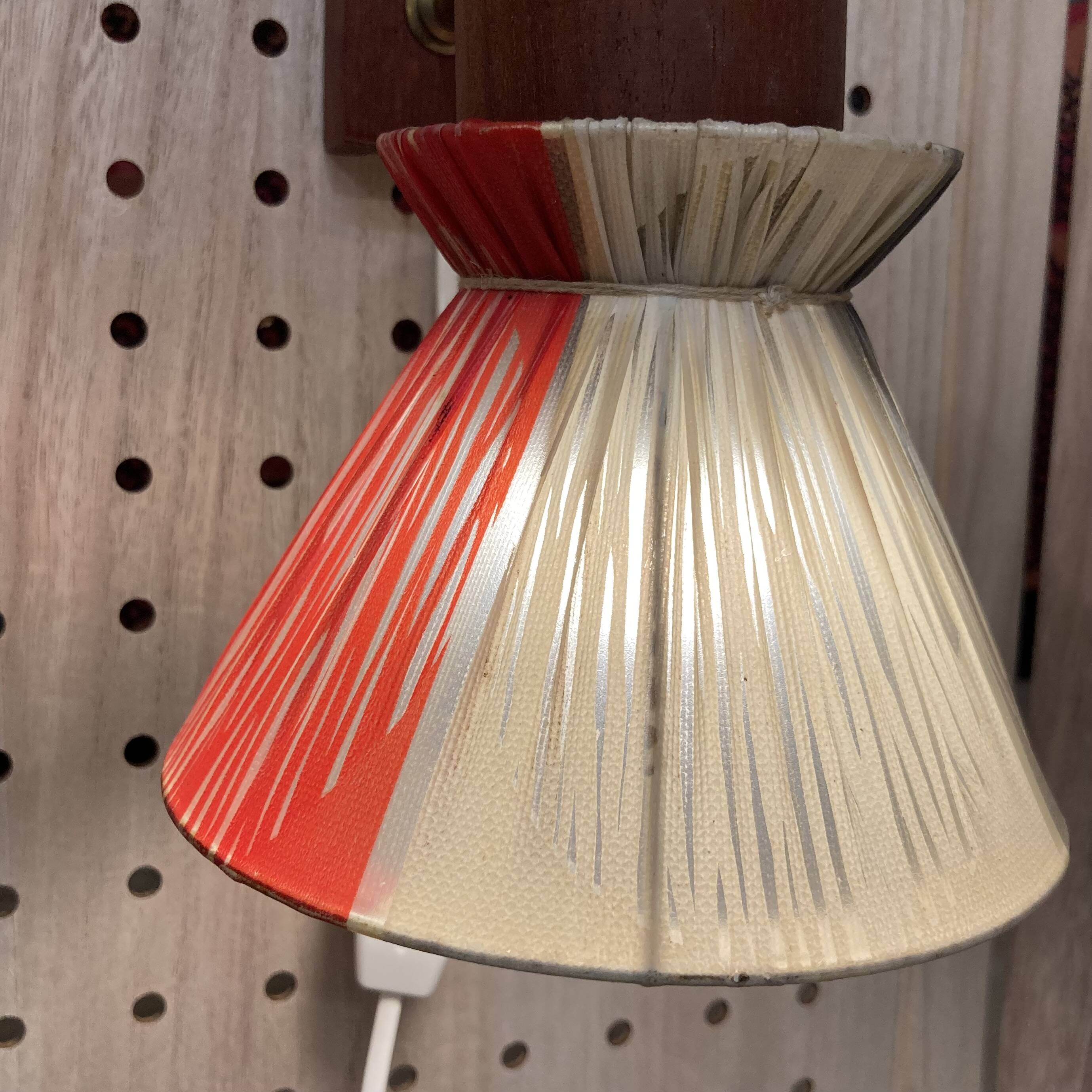 Scandinavian design wall light in teak and brass from the 1950s.