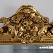 Baroque mantel mirror in carved wood and gilded plaster, France circa 1850.