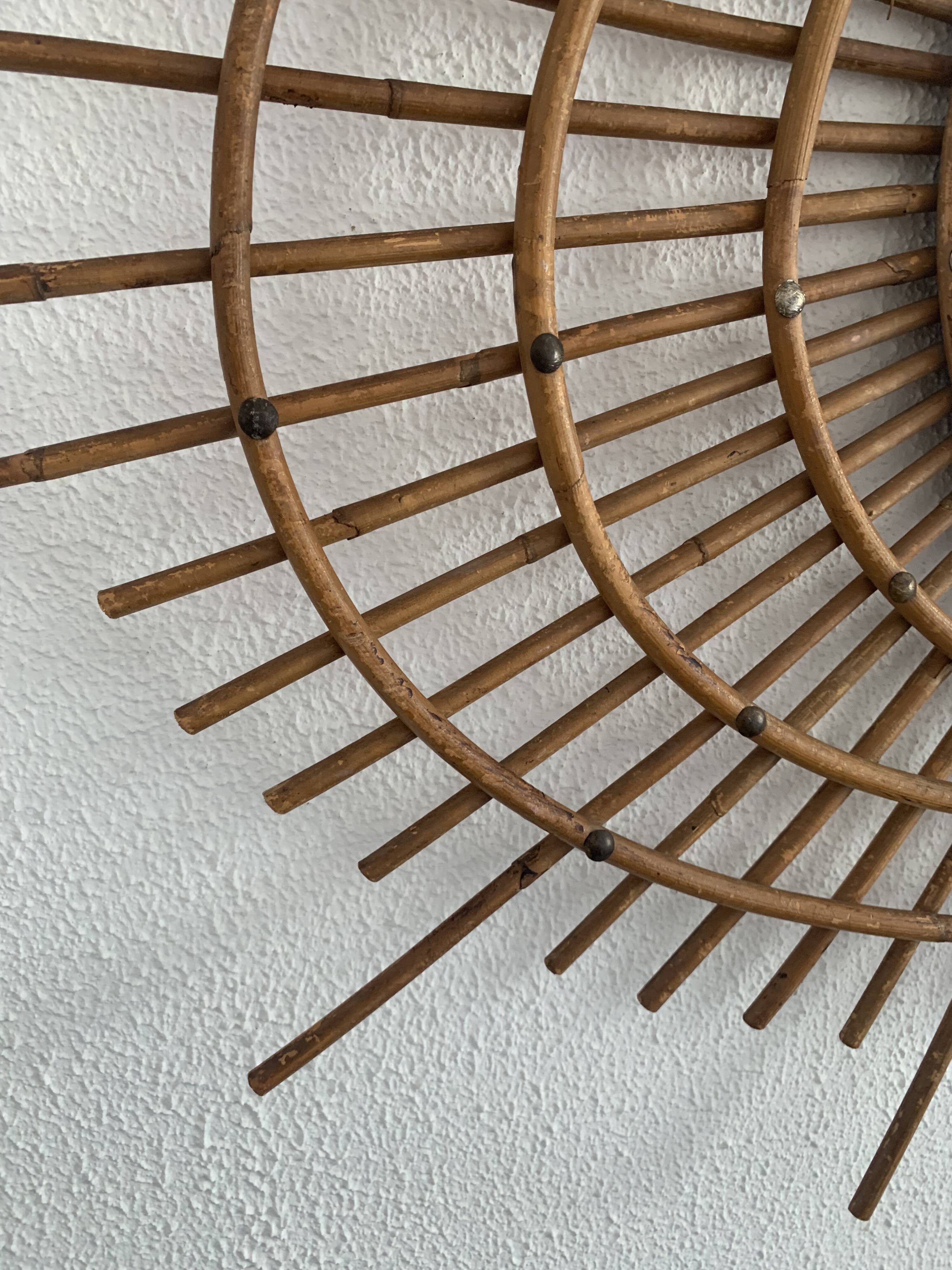 Vintage 1960s sunburst rattan ortf style spiral eye mirror - 90 x 67 cm