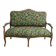 Louis XV bench reupholstered with a green tropical pattern.