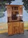 Glass-fronted oak sideboard from the Art Nouveau period.