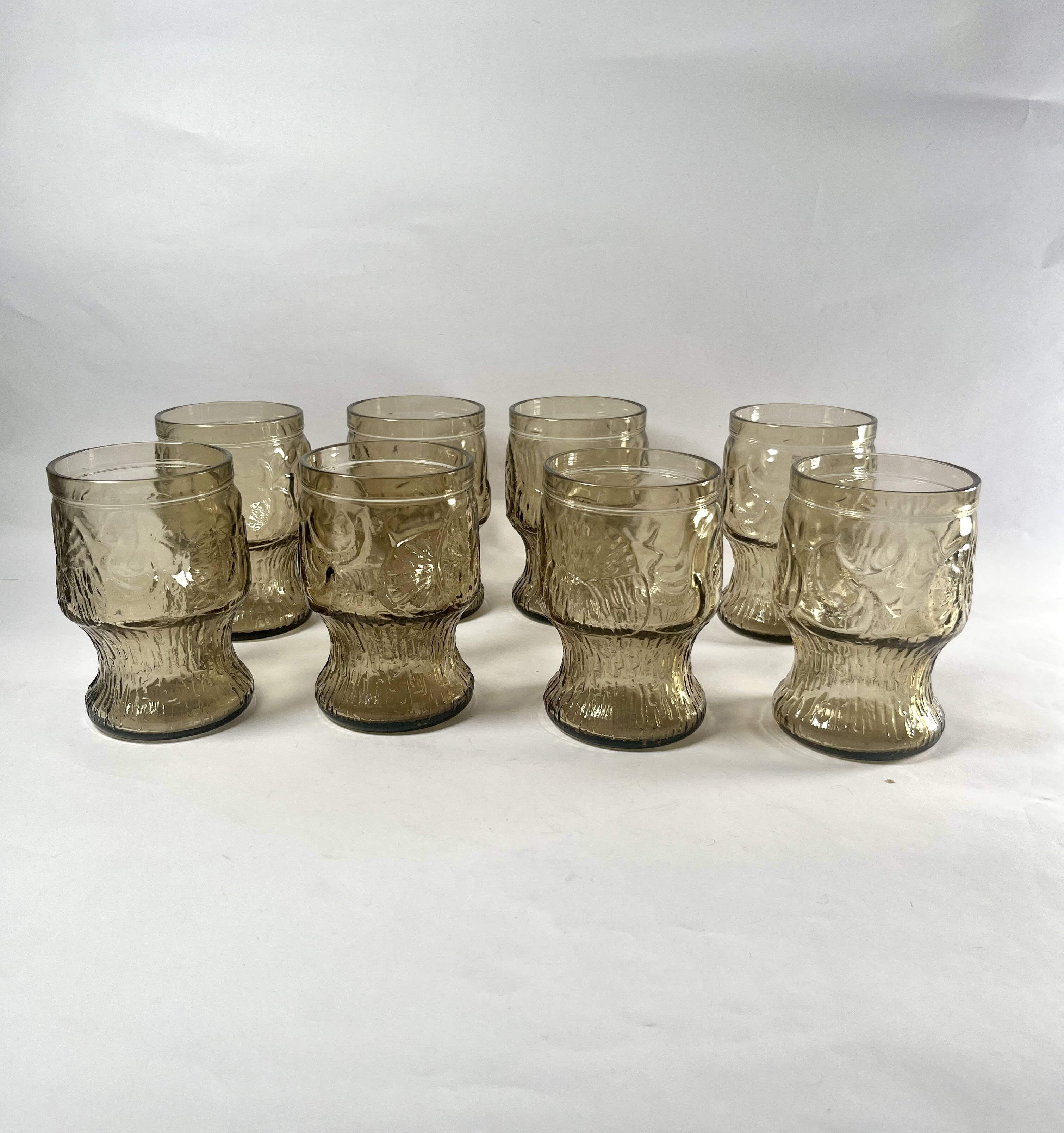 Brown water glasses decorated with citrus slices