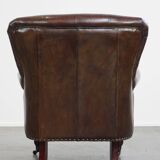 Cognac colored brown grained cowhide chesterfield armchair