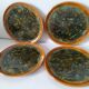 Set of 4 flamed enamel plates in green and amber from the 60s-70s.