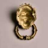 Lion door knocker, in brass