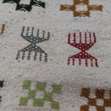 White carpet with multicolored Berber patterns handmade