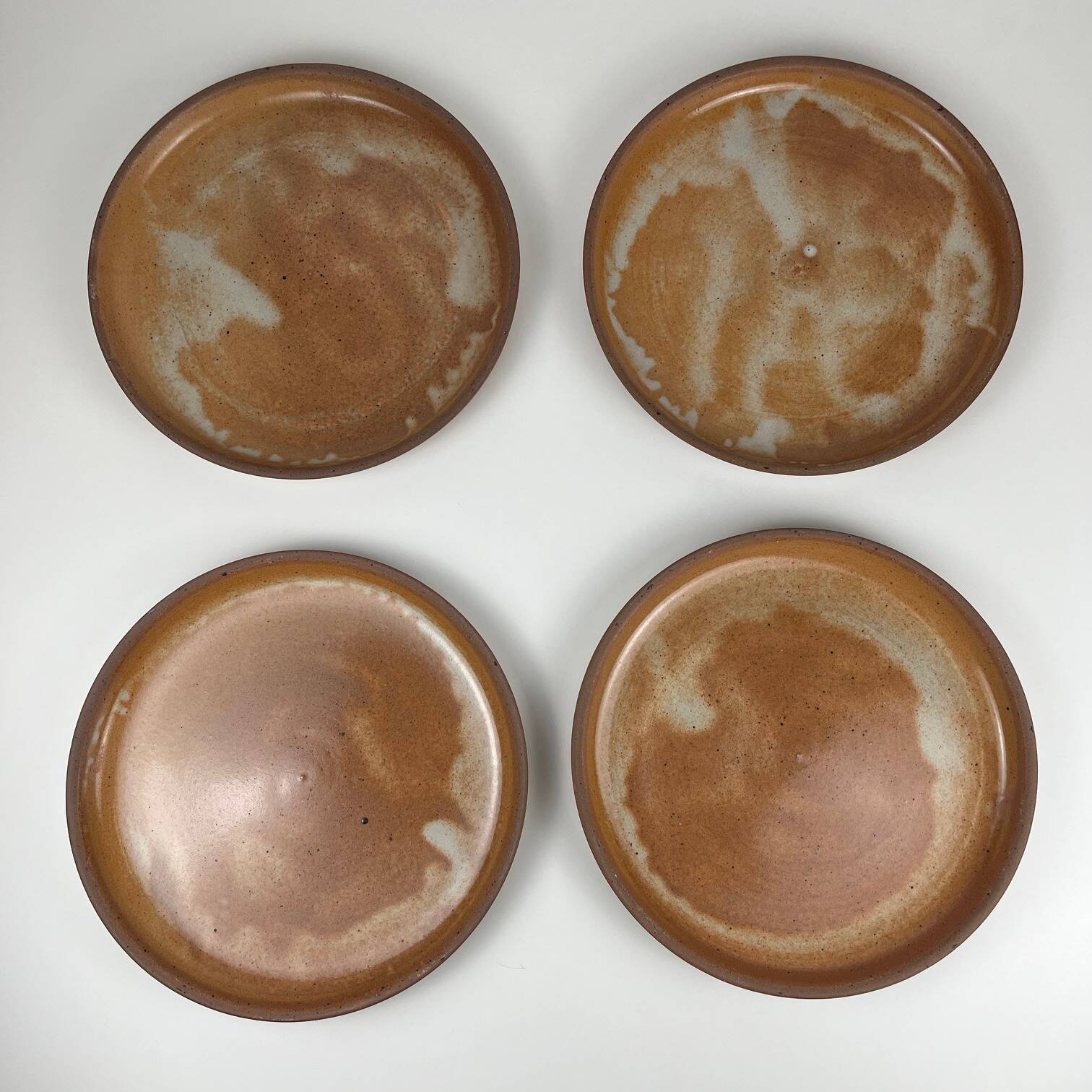 Set of 4 brutalist terracotta plates, brown/red tone, 1970