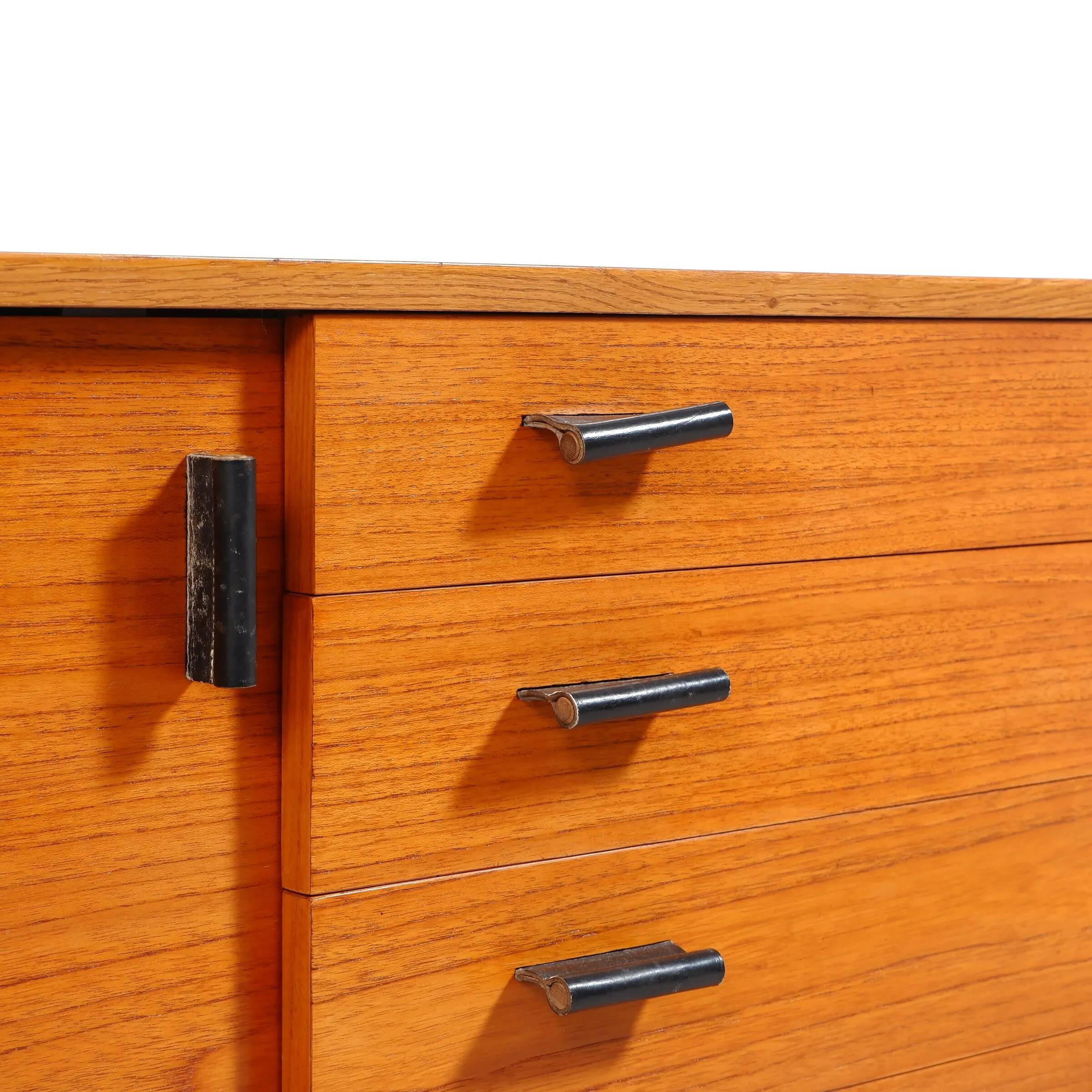 Swedish teak sideboard with leather handles