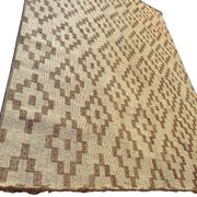 Vintage Touareg mat made of leather and reeds.