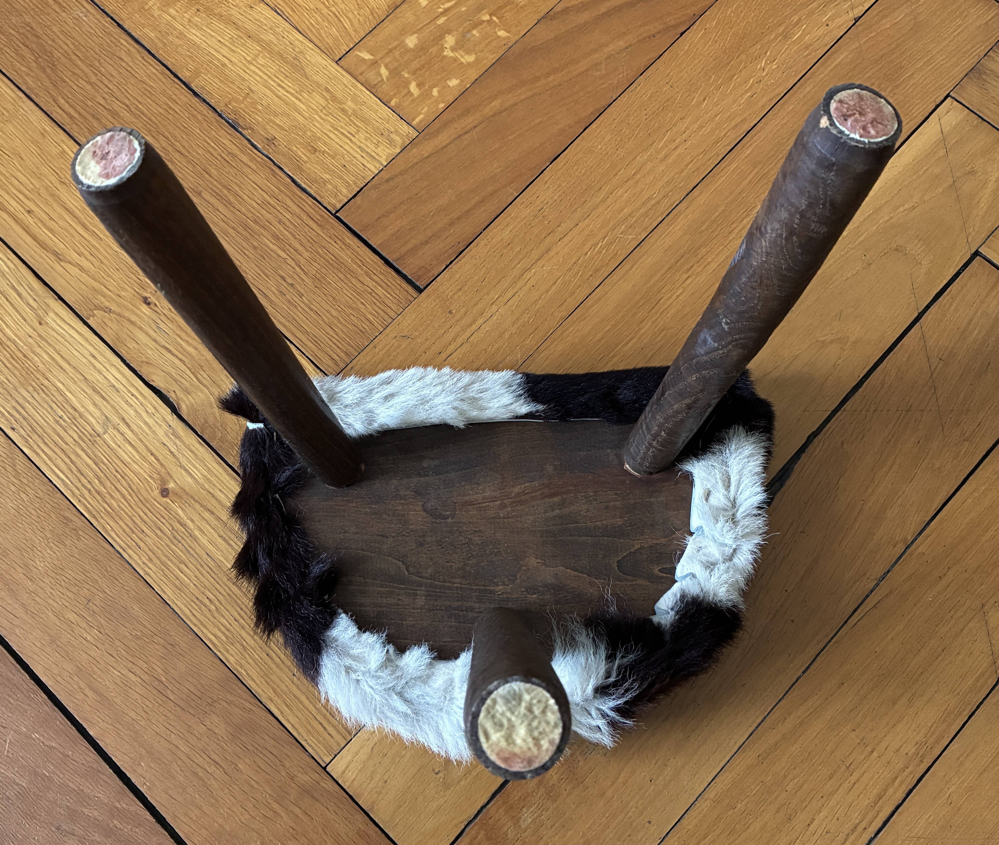 Small tripod stool in cowhide