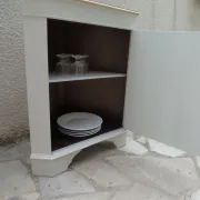 Vintage English corner cabinet enhanced in pearl grey, wooden top.