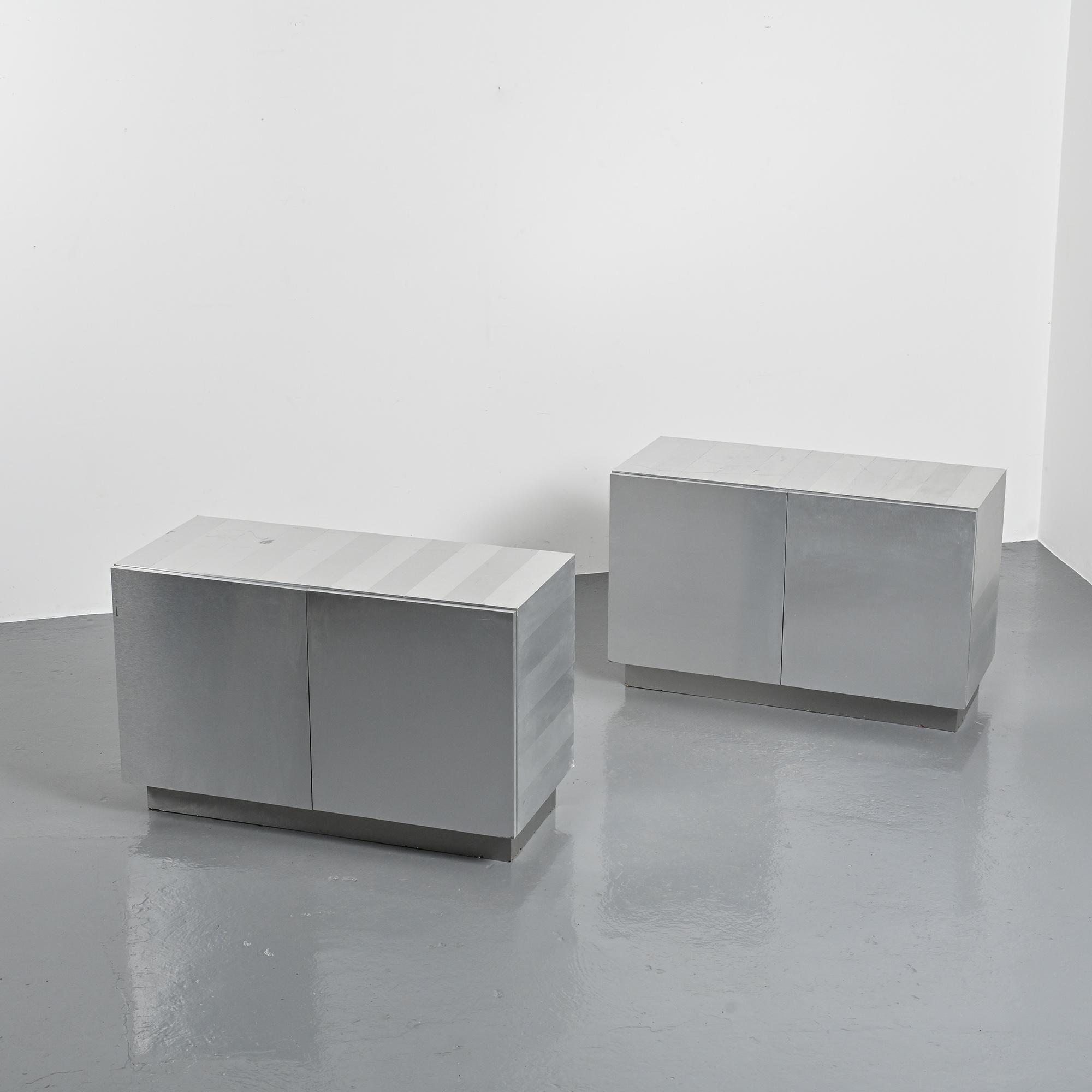 Pair of low buffets in brushed metal, French work, 1970s.