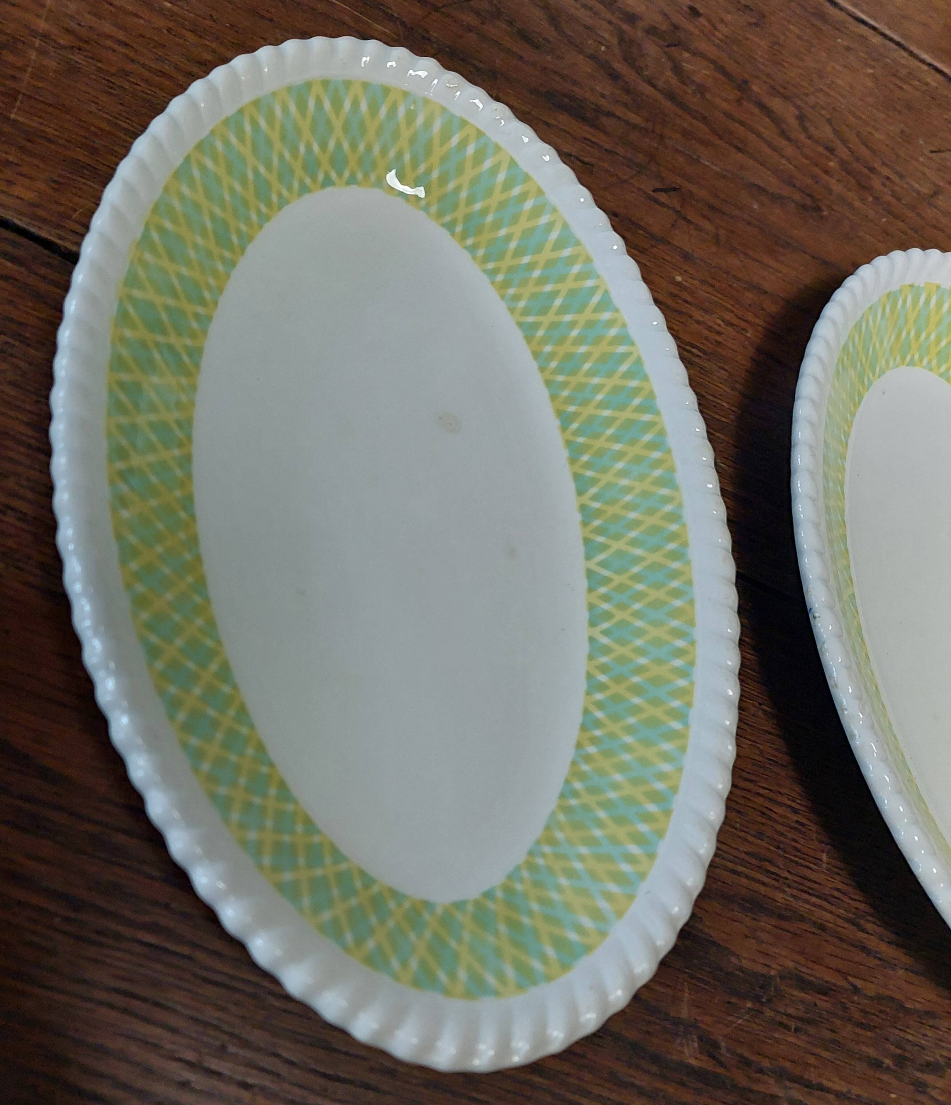 Pair of Badonviller iron earthenware dishes, Amina model