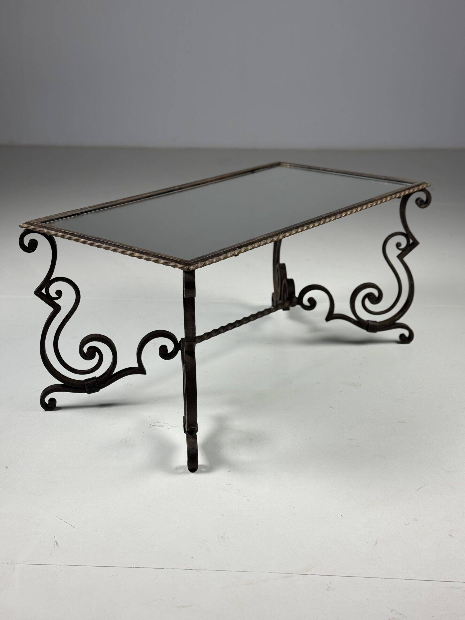 Wrought iron coffee table with mirror glass