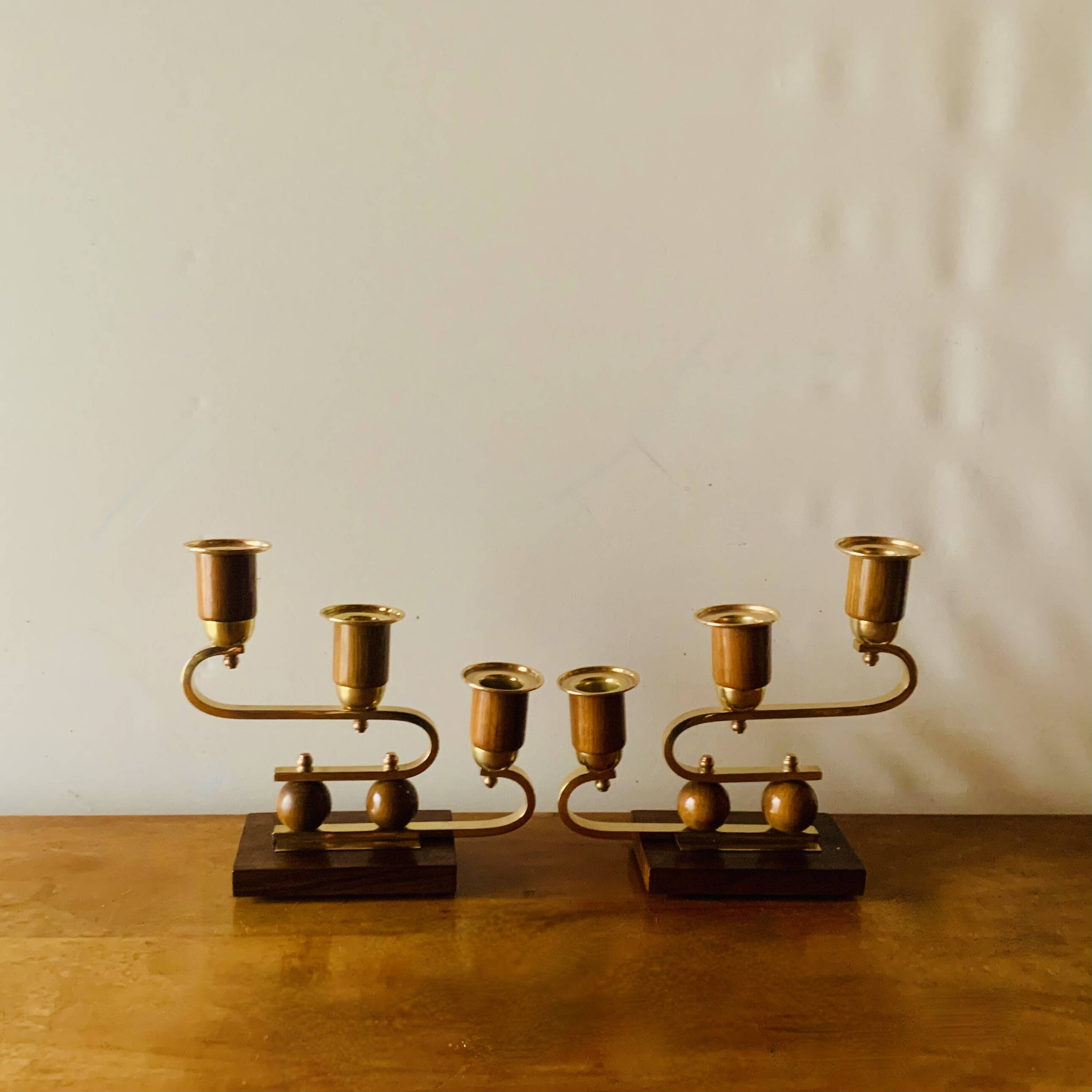 Pair of Art Deco candlesticks in gilded brass and wood