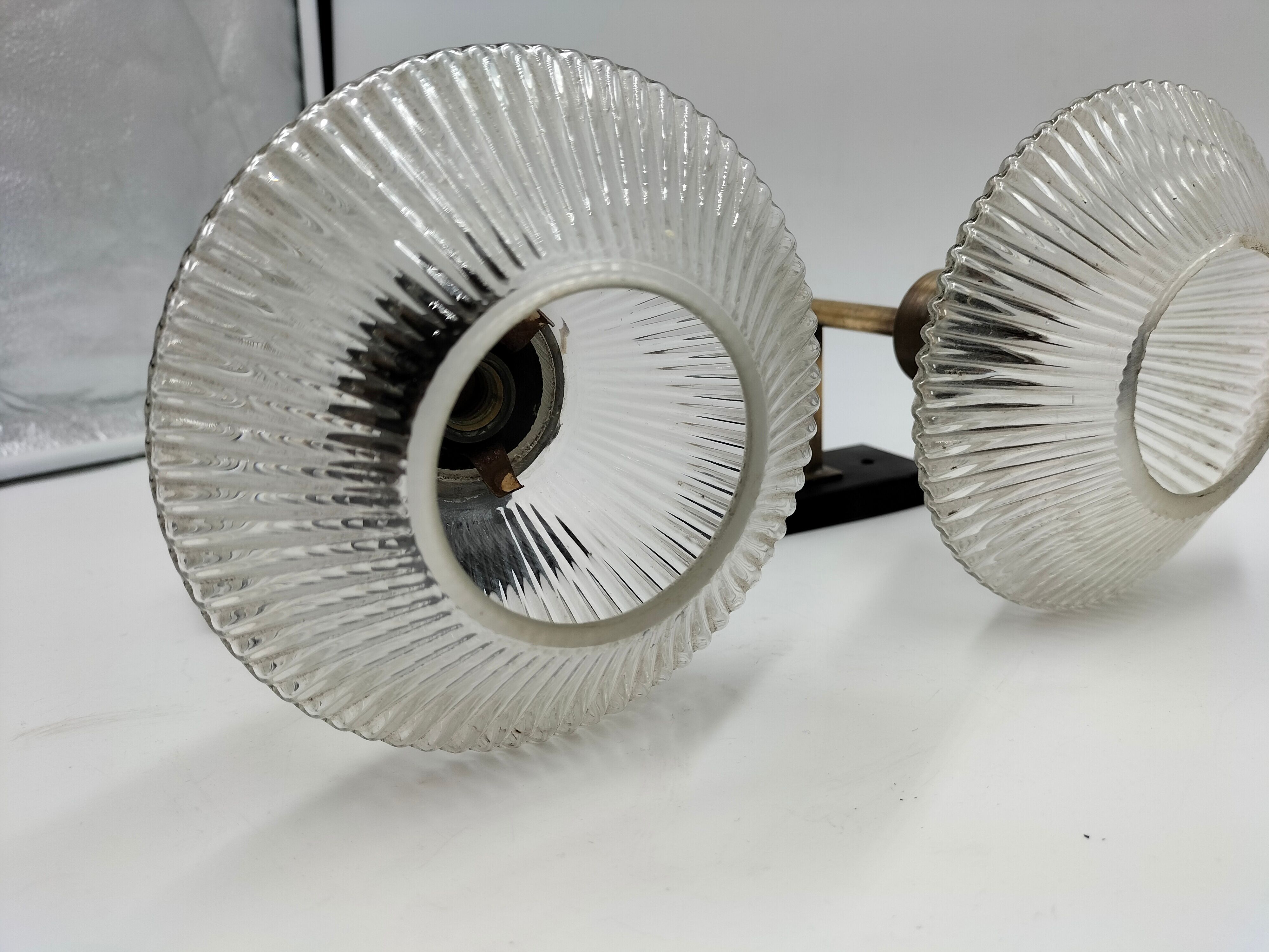 Pair of brass and glass wall lamps