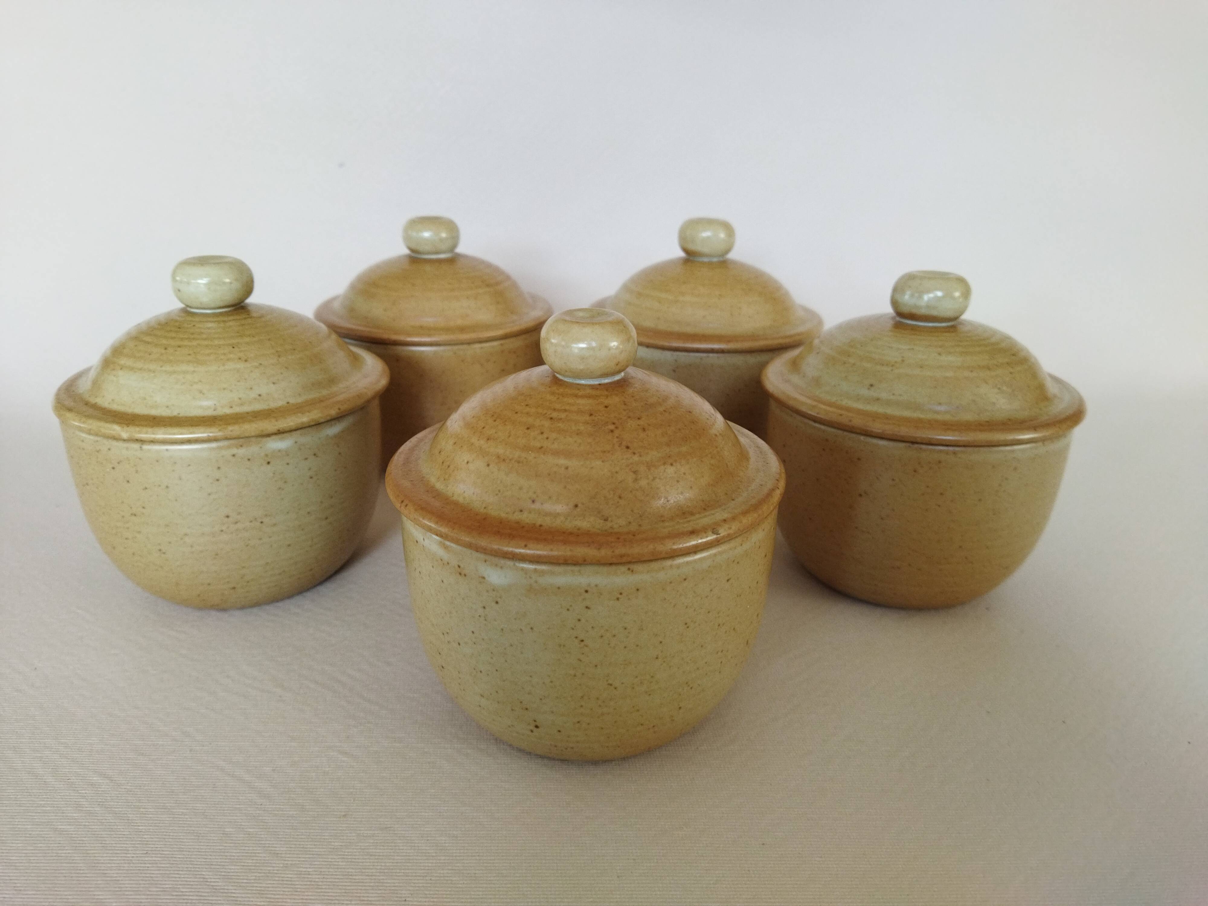 Covered tea bowls in CNP Village sandstone