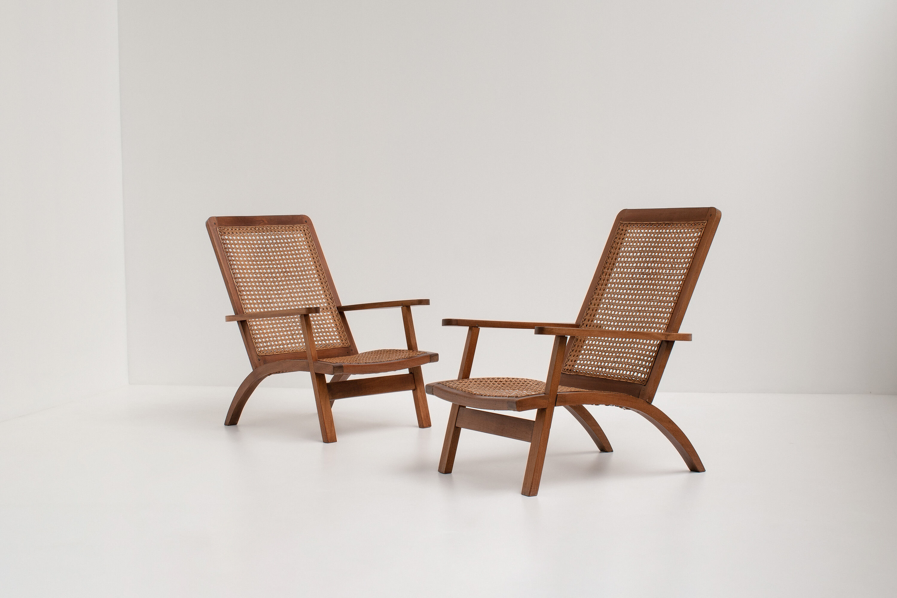 pair of french mahogany and cane armchairs, 1950s