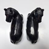 Black marble bookends with lying horses