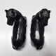 Black marble bookends with lying horses