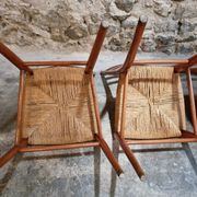 Set of 4 mid-century Italian dining chairs with woven seats, circa 1950–1970.