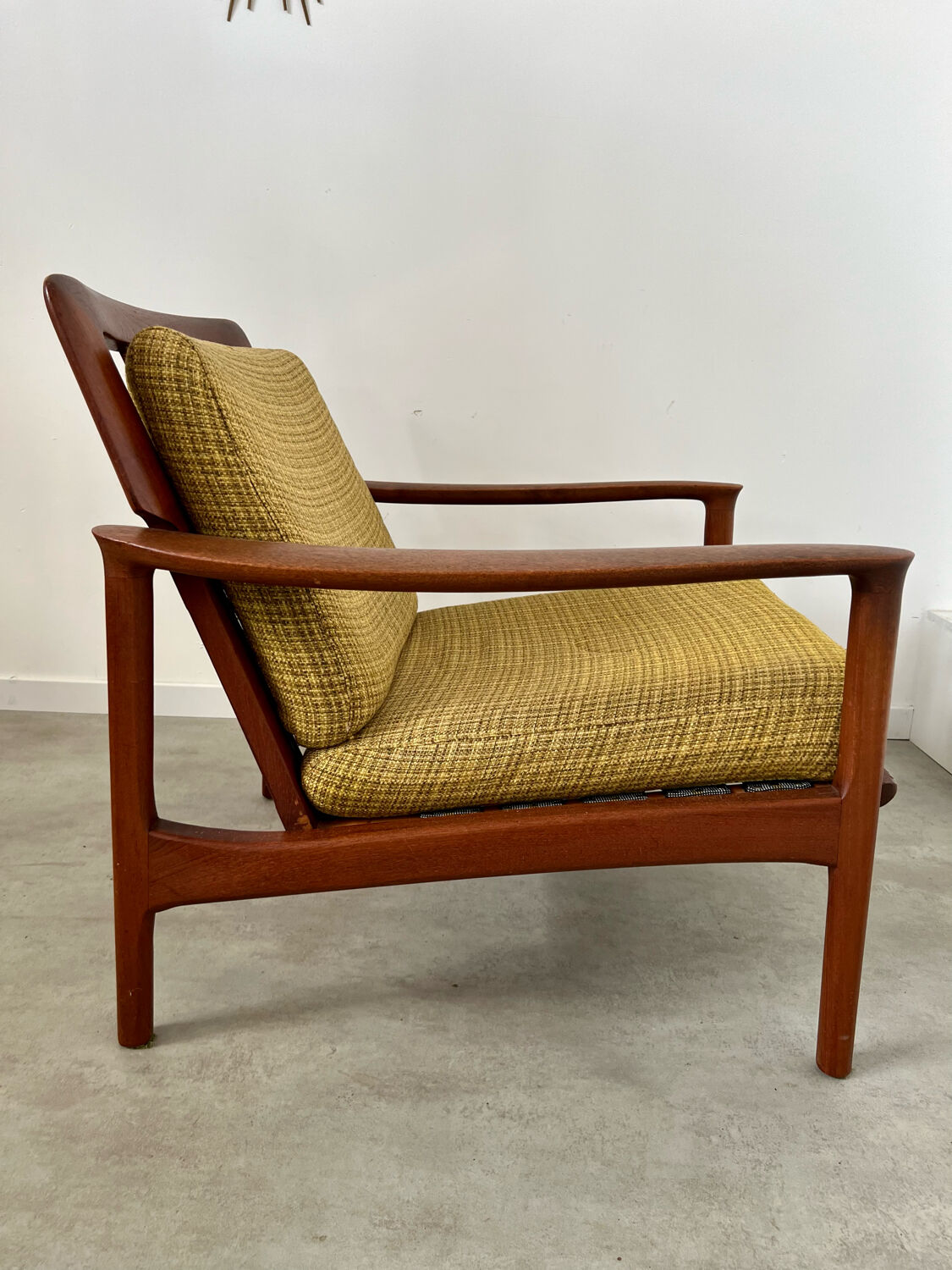 Old Scandinavian design armchair in vintage teak year 60