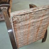 Pair of Art Deco armchairs in curved wood and multicoloured fabric from the 1920s.