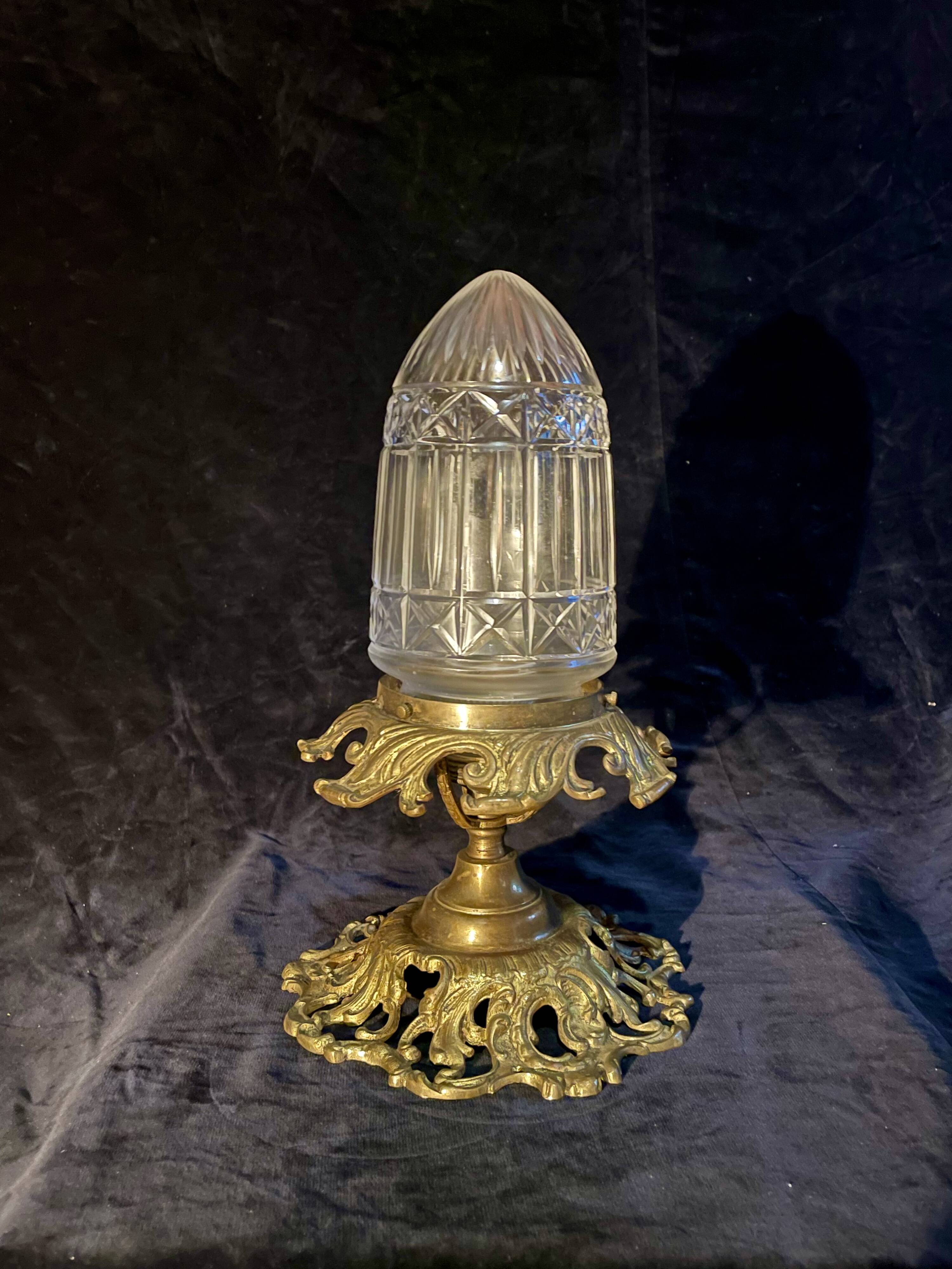 20th-century ceiling light, chiselled obus and brass.