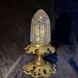 20th-century ceiling light, chiselled obus and brass.