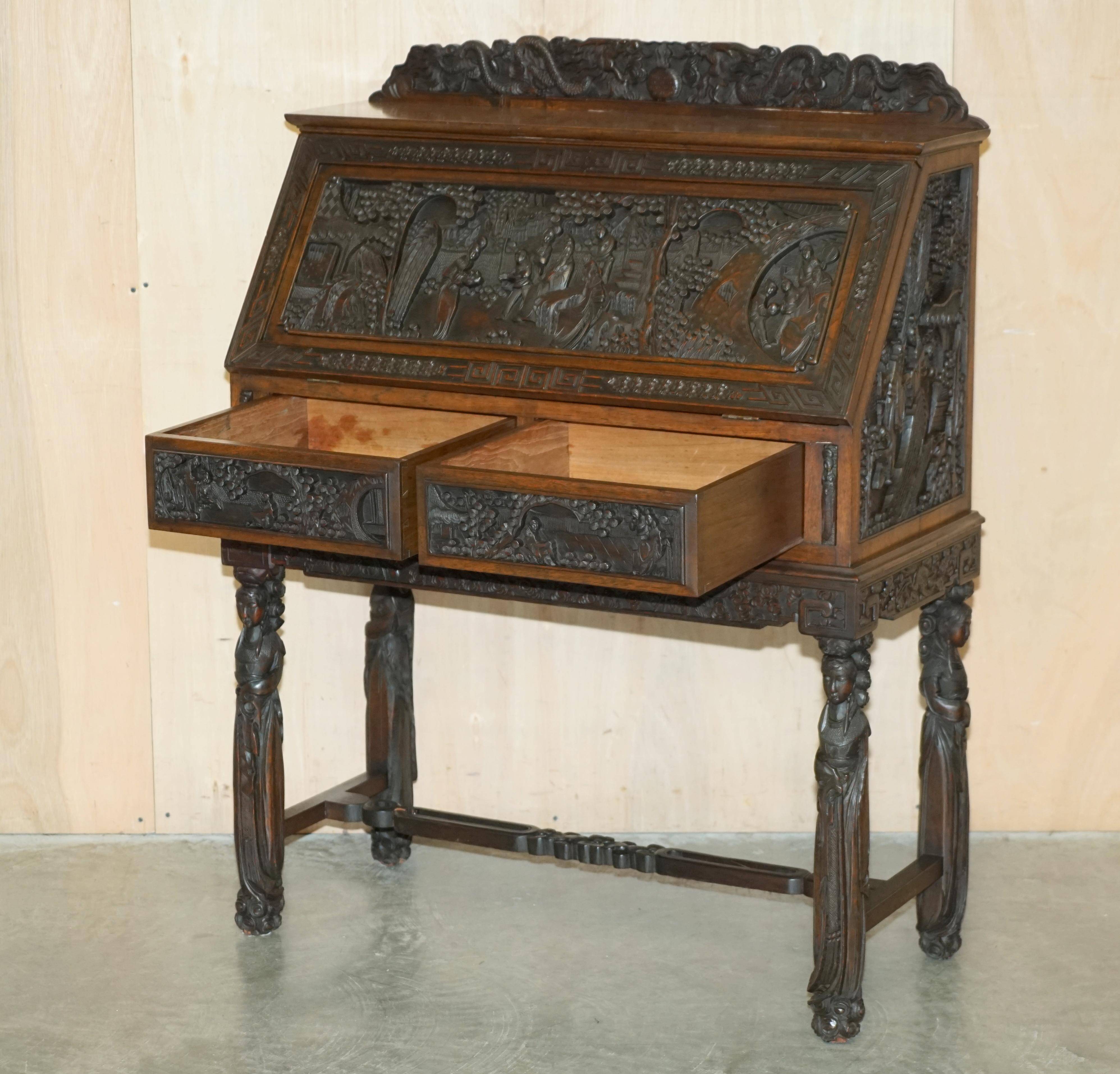Chinese hand-carved desk from around 1940 with matching chair.