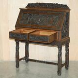 Chinese hand-carved desk from around 1940 with matching chair.