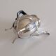 Empire-style silver-plated coffee pot with eagle head spout.