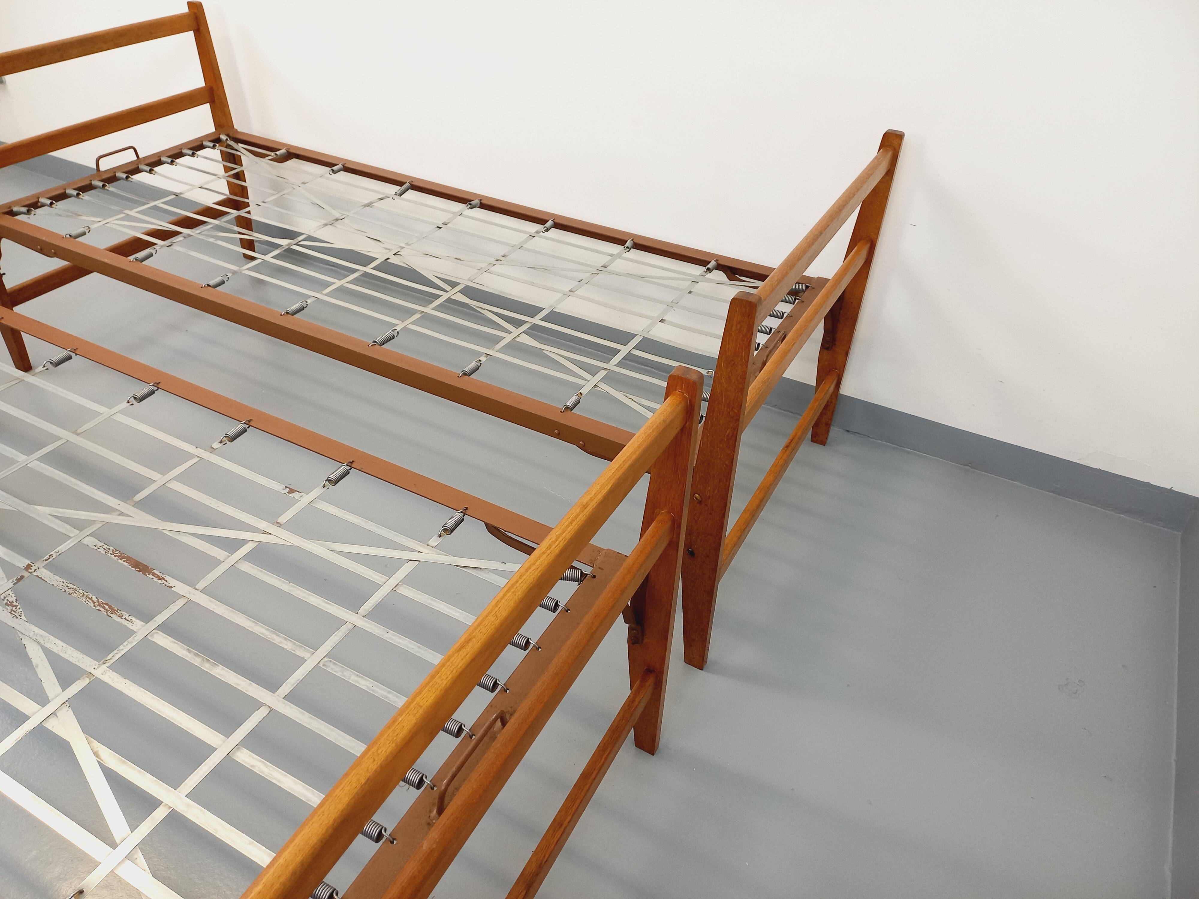 Pair of vintage stackable daybeds in oak wood and metal from the 60s