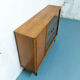 Console with sliding doors