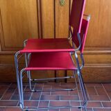 2 tubular chairs in red leather 1970