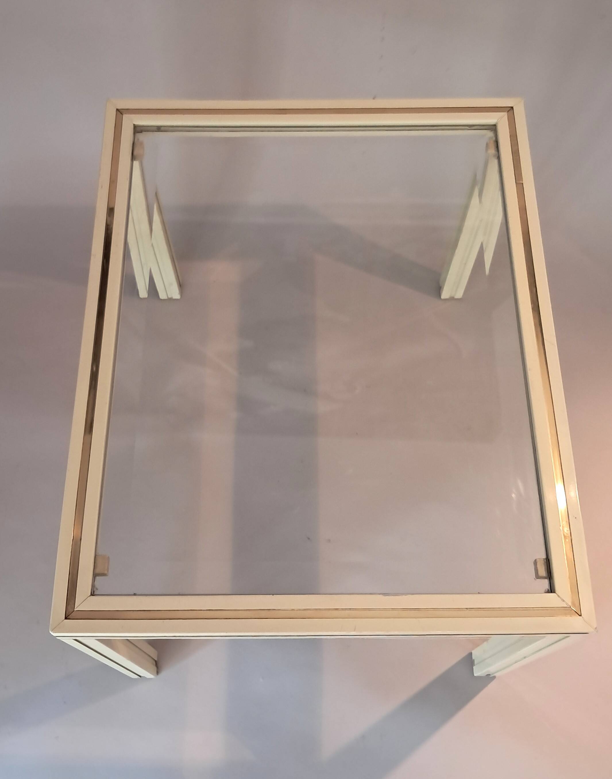 White lacquered side table by Pierre Vandel with gold brass.