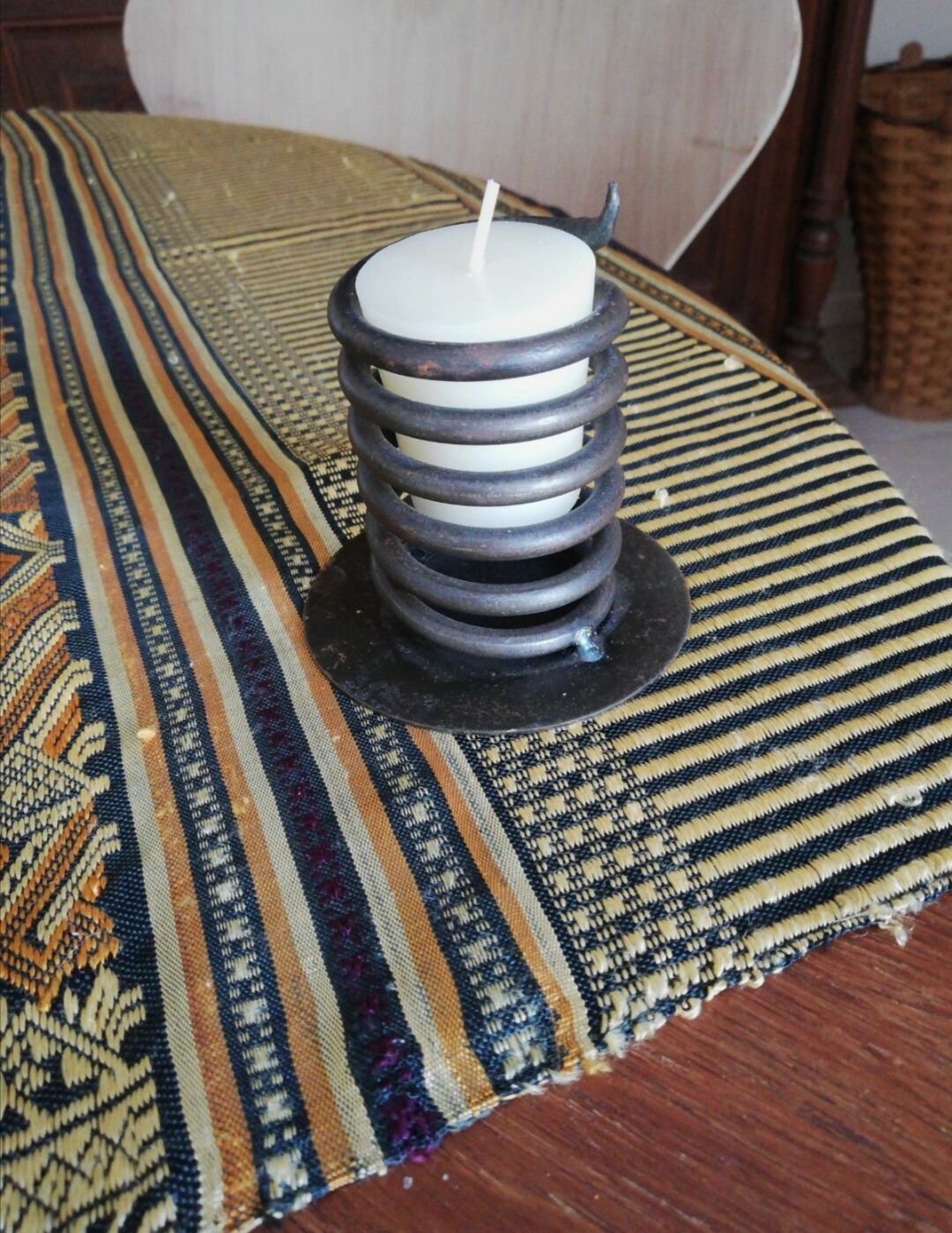 Spiral metal candle holder spring with candle, bronze appearance