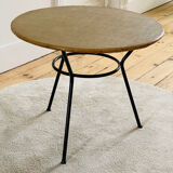 Tripod coffee table with a straw covering.