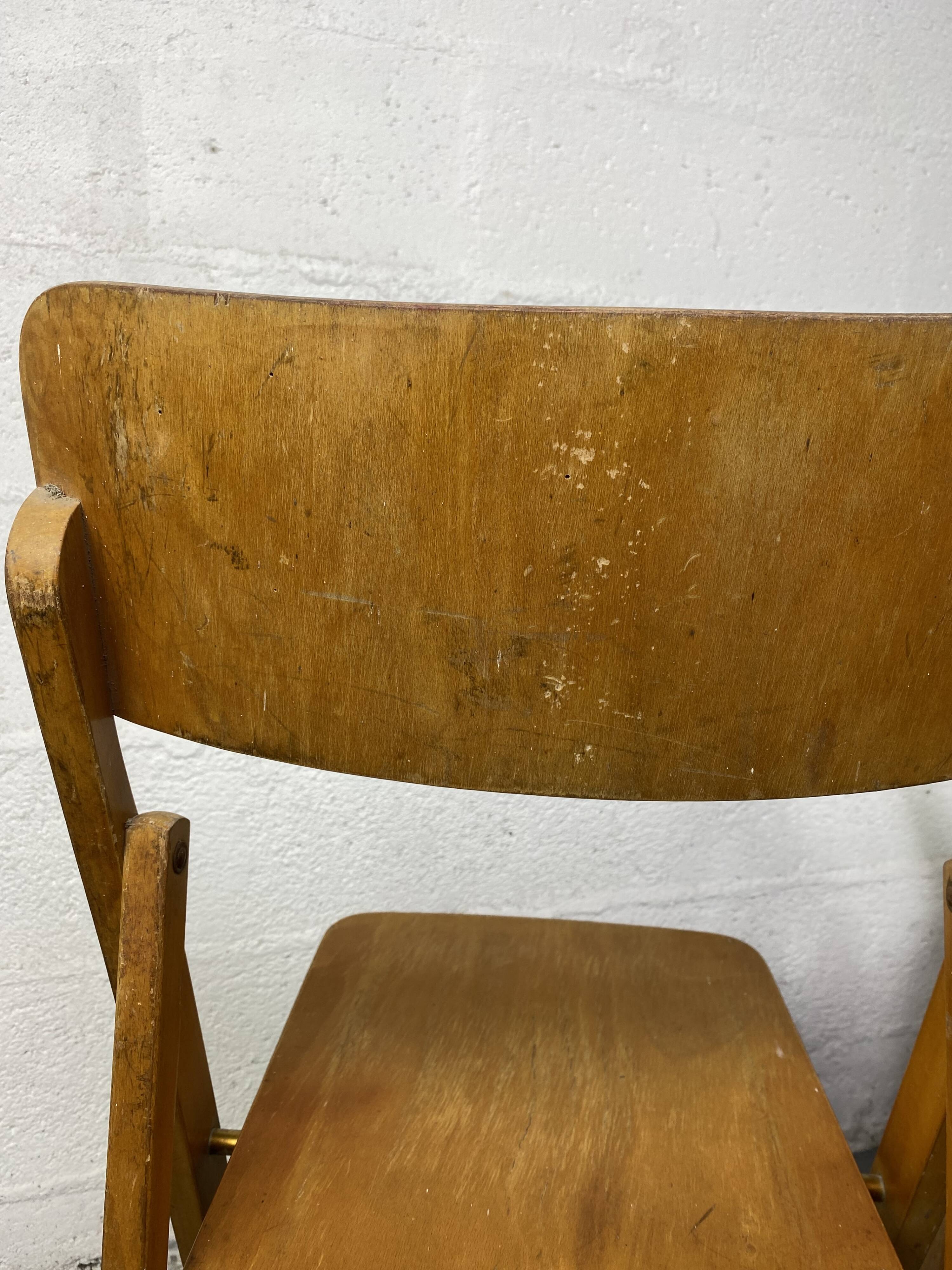 Pair of mismatched wooden folding chairs