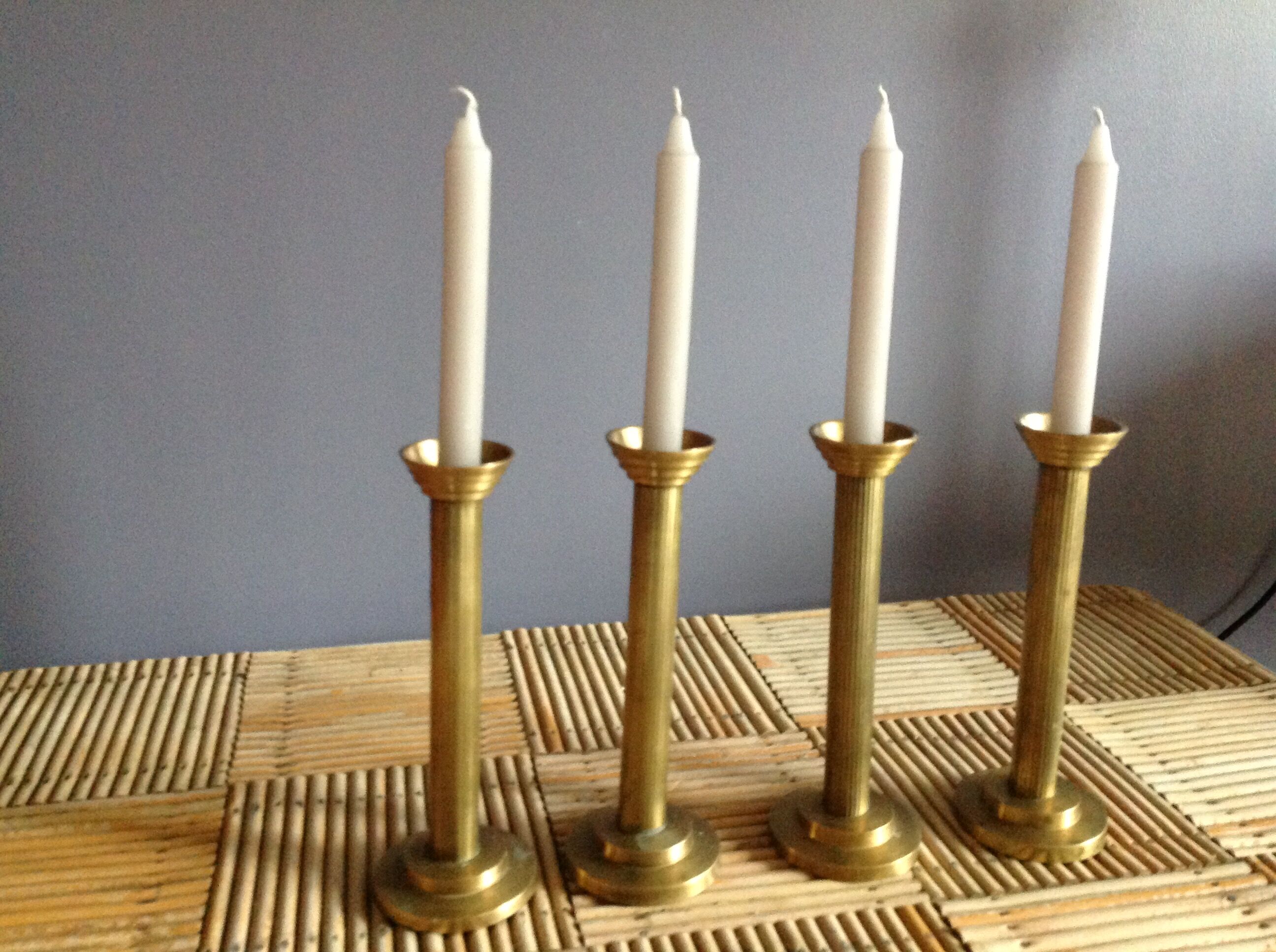 Series of 4 brass candlesticks