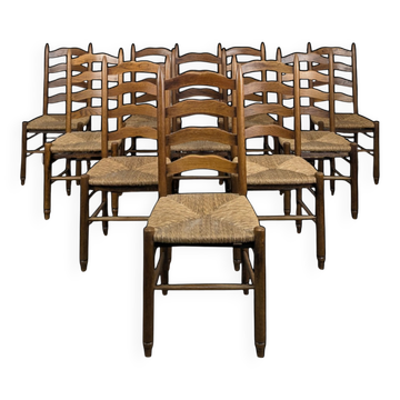 Series of 10 chairs in the style of Charlotte Perriand.